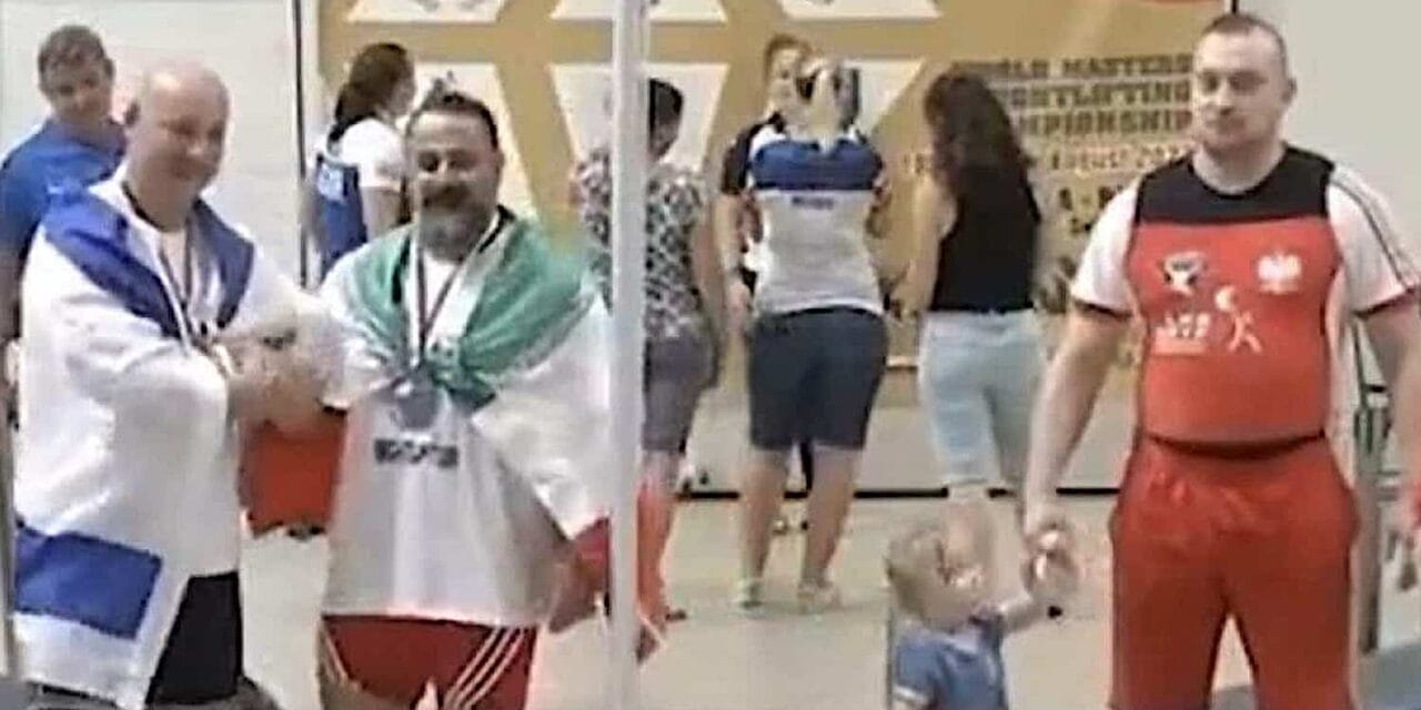 Iranian weightlifter banned for life after shaking hands with Israeli